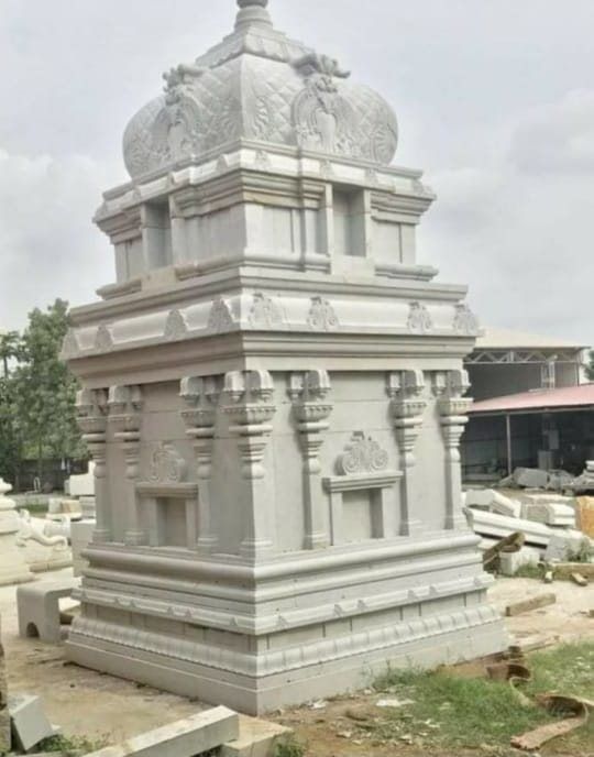 Carved granite vimana tower standing finished in the stockyard