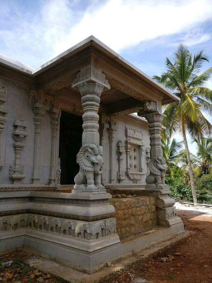 Stone shrine porch framed by carved yali columns