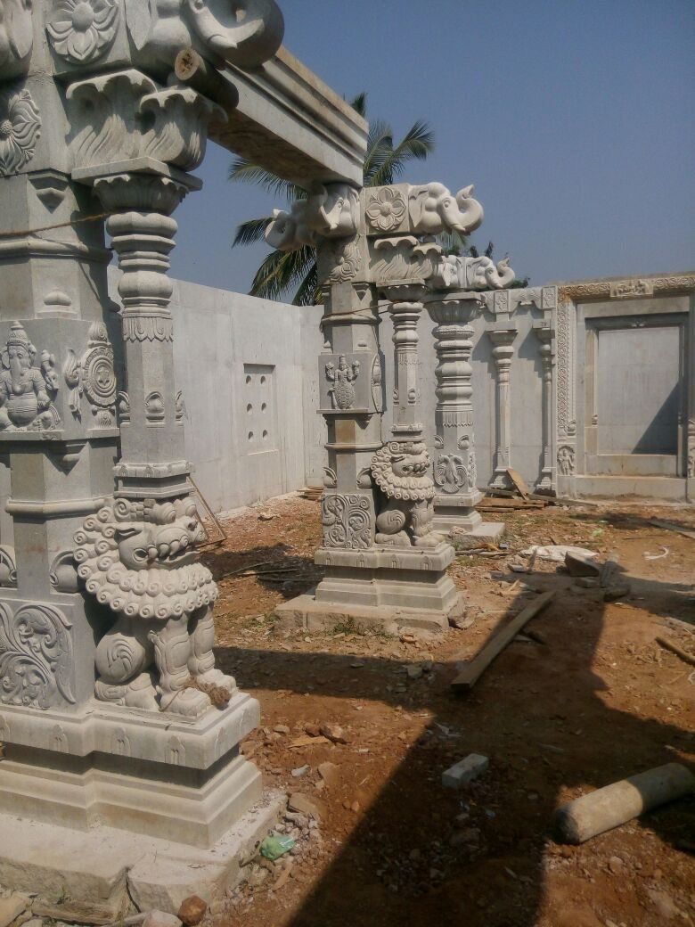 Carved granite columns erected as part of a mandapa colonnade