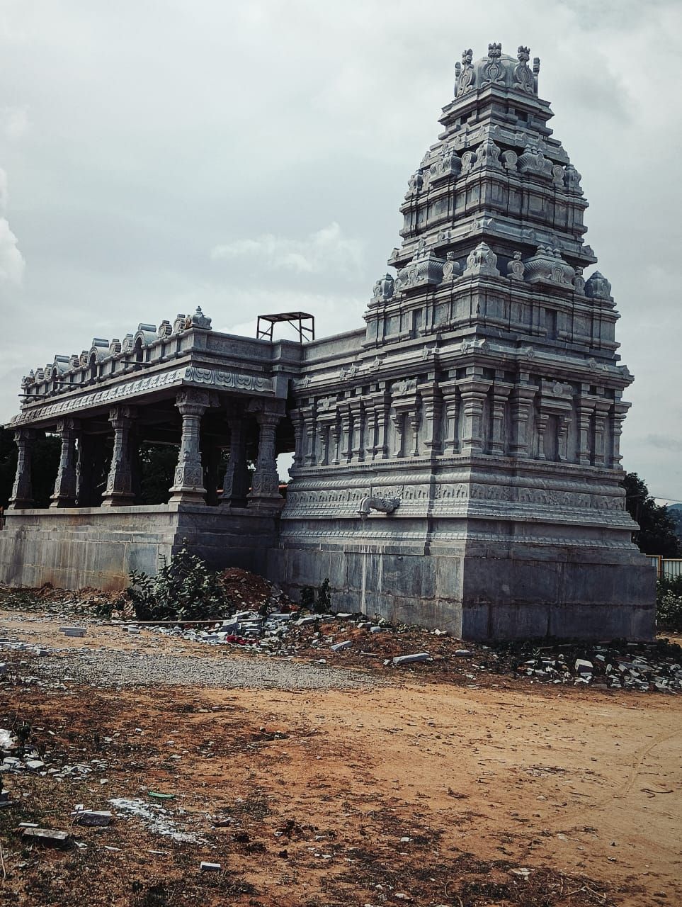 Granite temple with a completed gopuram and mandapa