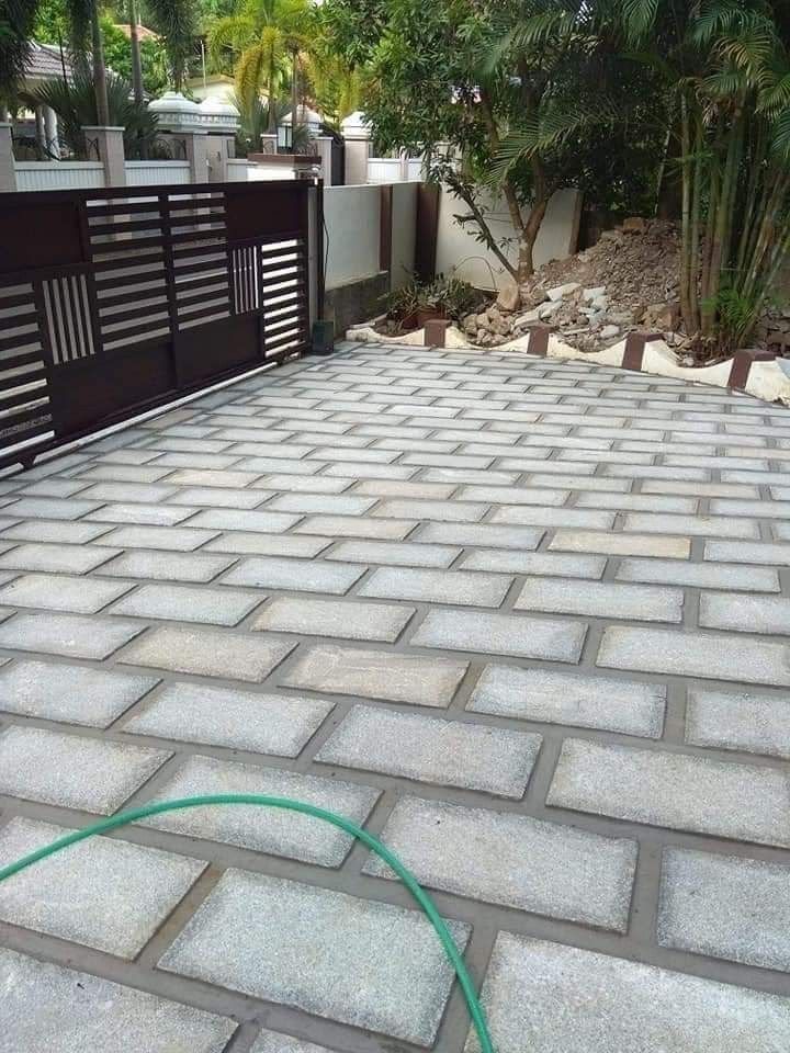 Interlocking paver pathway beside a lawn