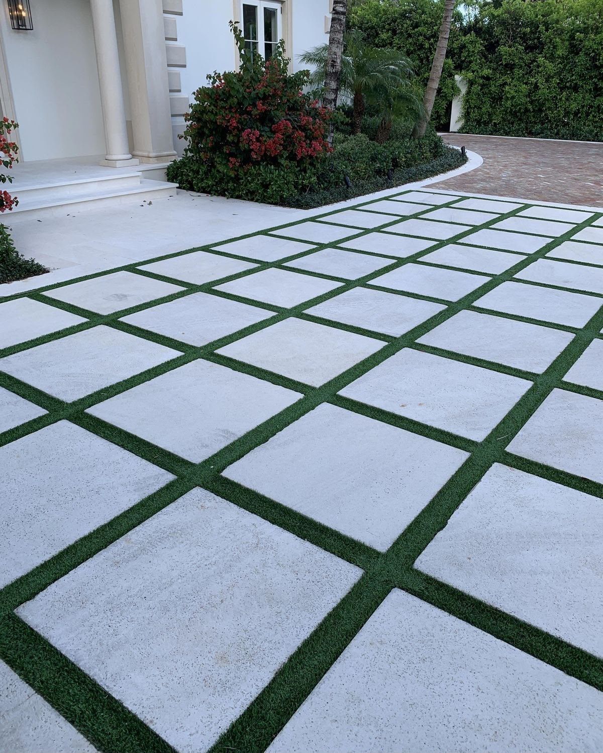 Grass-joint parking stone with turf between pavers